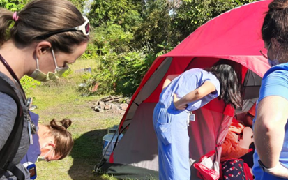 Delivering Street Medicine in Rural Michigan. Munson Healthcare's Rural Street Medicine Residency Expansion Project clinicians visit a patient living rough in a tent.