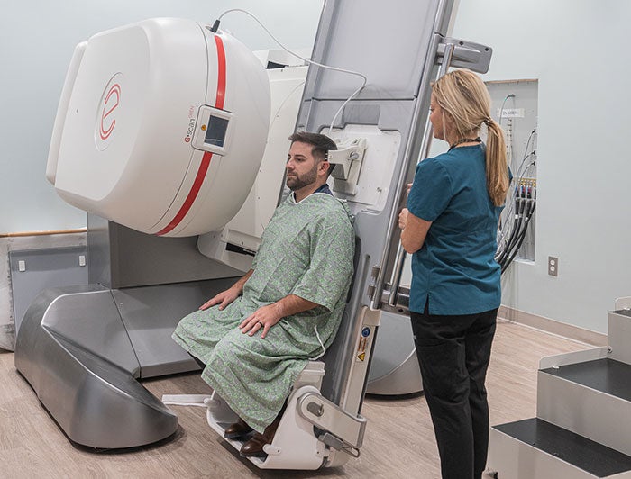 MUSC’s First Upright MRI Is Changing Lives, Thanks to One Patient’s Vision. A clinician positions a patient for an MRI.