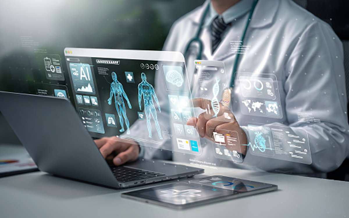 Mayo Clinic Unveils Global Data and Insights Platform to Support Health Systems Worldwide. A clinician reviews medical data projected in front of him from a laptop computer and a tablet.