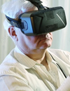 Mindmaze. A senior citizen wearing a virtual-reality headset.