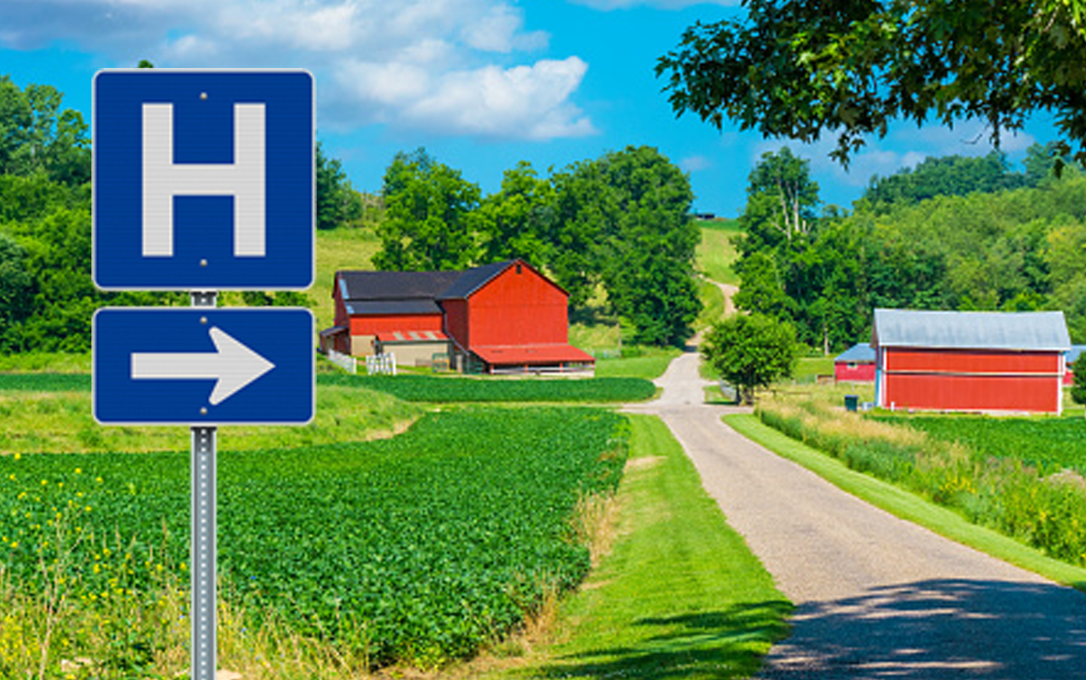 Ohio Rural Hospitals Form Clinically Integrated Network. A hospital sign next to a road in a rural landscape.