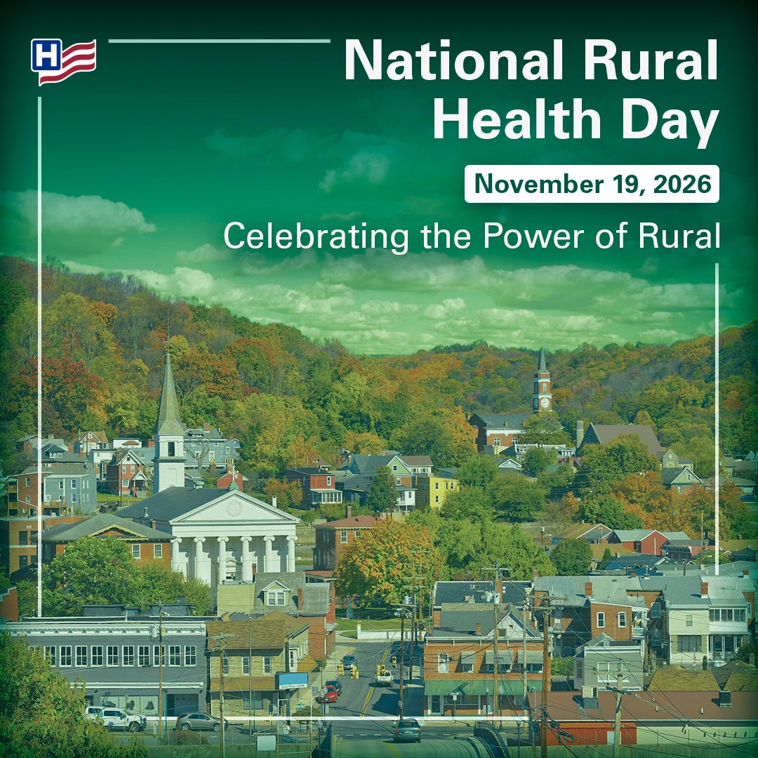 National Rural Health Day Banner Image of Green town landscape with tree lined mountains in the background.