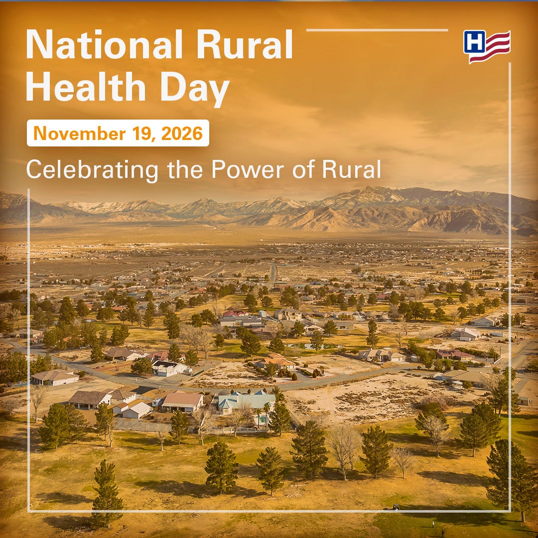 National Rural Health Day Banner Image of rural town lanscape with vast mountain backgroun in orange hue.