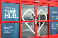 The CVS HealthHUB logo on the door of a CVS store.