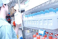 Technologies to Fortify Your Supply Chain. Health care worker selecting bottle from a supply shelf.