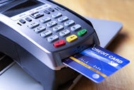 Patients to Pay More Out of Pocket for Virtual Care. A credit card with a chip in a credit card reading machine processing a copay patient charge.