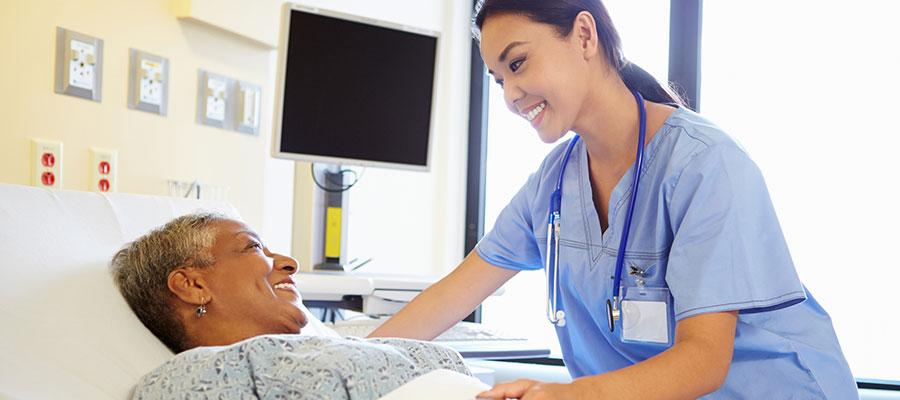 happy-patient-nurse-hospital-bed