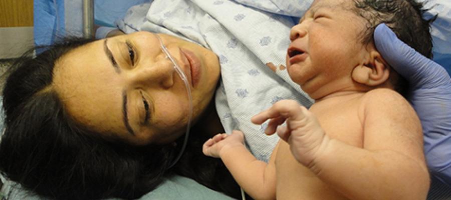 Maternal Health - mother and newborn in delivery room