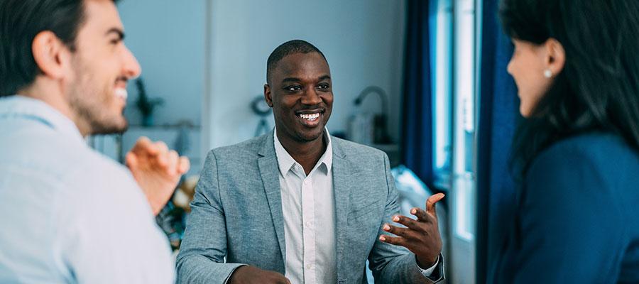 business man talking animatedly with colleagues