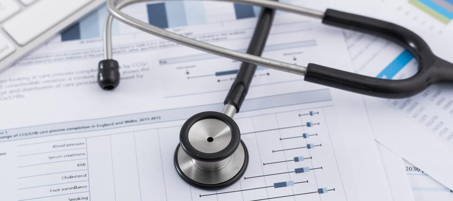 Stethoscope on financial documents