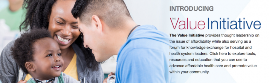 Two adults with baby in Value Initiative banner