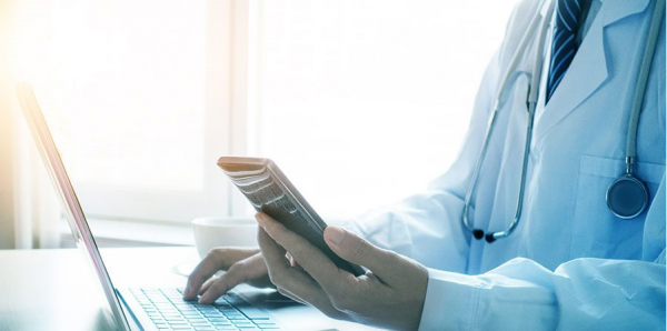 Clinician listening to a The Value Initiative podcast on his phone