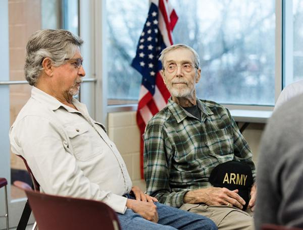 Older veterans sit talking at the The Geriatric Inpatient Mental Unit at Oklahoma City VA Health Care System