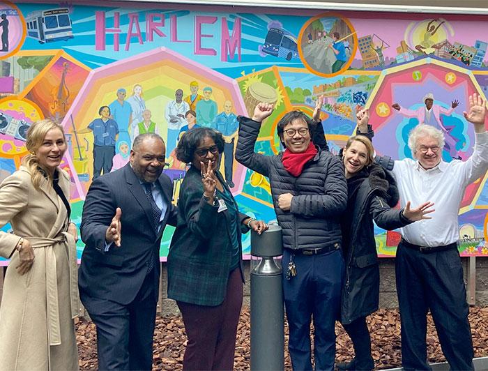 NYC Health + Hospitals team in front of Chromatic Symphony of Greater Harlem