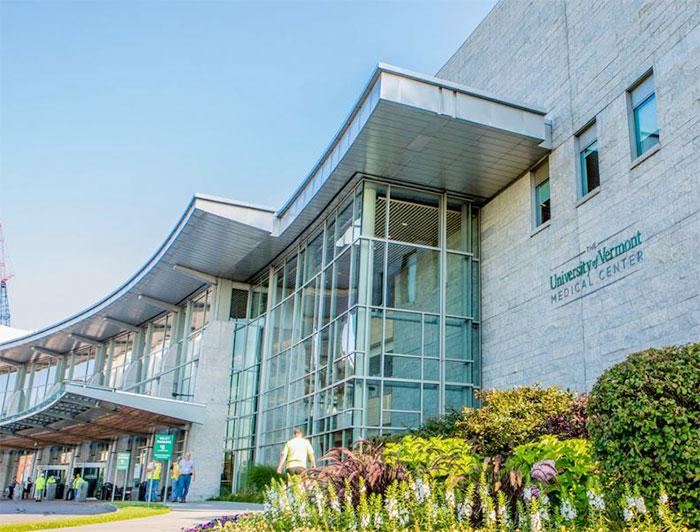 University of Vermont Health Network facility exterior against a blue sky
