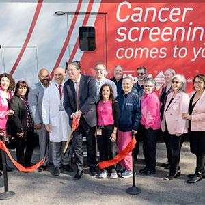 People gathered at ribbon cutting ceremony for opening of Fox Chase Cancer Mobile Screening Unit