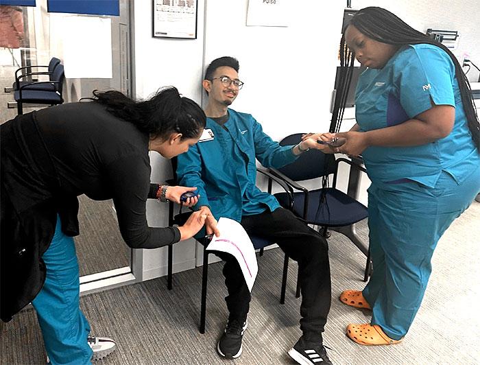 Participants in the Northwestern nurse training program practice skills