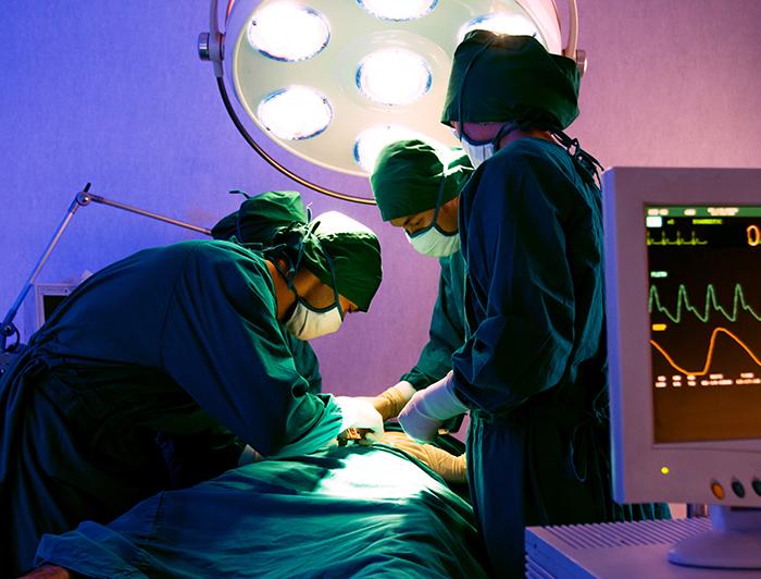 Stock image of surgeons operating on a patient