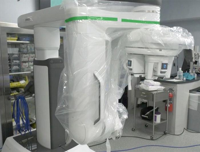 Surgical robotic device sits in a hospital room