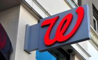Walgreens Bets Future on Health Care and New Leadership. A Walgreens sign hanging from the front of an urban building.