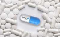 Will Blue Shield’s New Pharma Model Disrupt the PBM Market? A blue and white capsule with Blue Shield's logo on it surrounded by white generic pills and capsules.