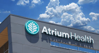 Atrium Health Extends Reach with Virtual Care to Improve Health and Elevate Hope. An Atrium Health sign on one of their facilities.