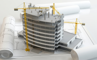4 Experience-Enhancing Hospital Design Strategies. A hospital facility modern in mid construction sits on blueprints of the facility.