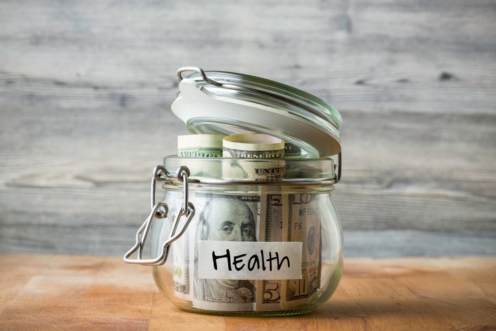 money in jar with labeled health