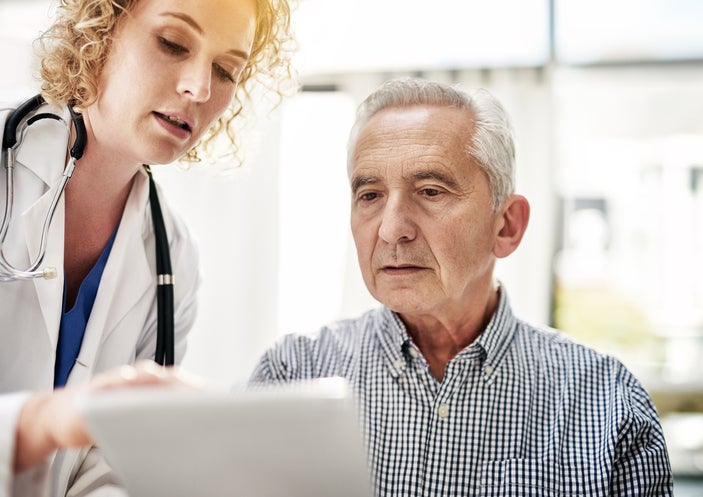 female doctor and patient looking at a laptop